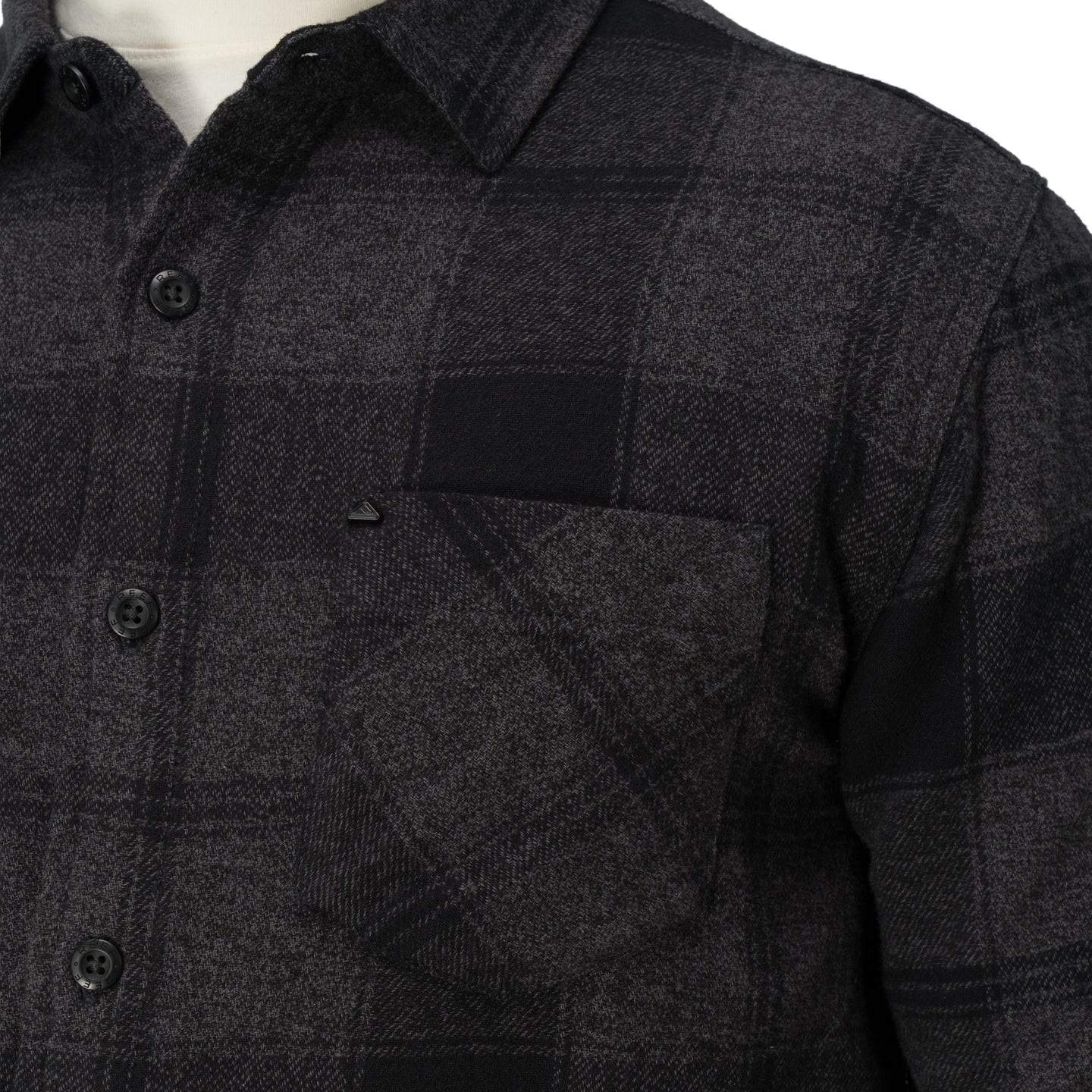 Close-up of the chest pocket and buttons on the Reggie Flannel Shirt in dark gray plaid from StoreRank.ai All Products.