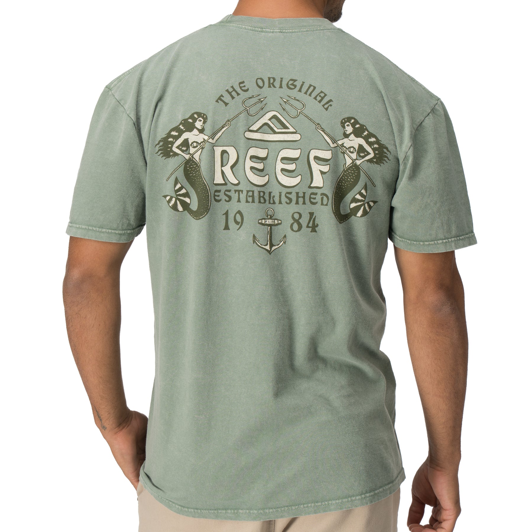 Back view of a man wearing the Twining Short Sleeve Tee with vintage Reef mermaid graphic, beach-inspired apparel.
