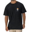Man wearing a relaxed fit black Salty Short Sleeve Tee with vintage skull and bucket hat artwork on chest, beach apparel.