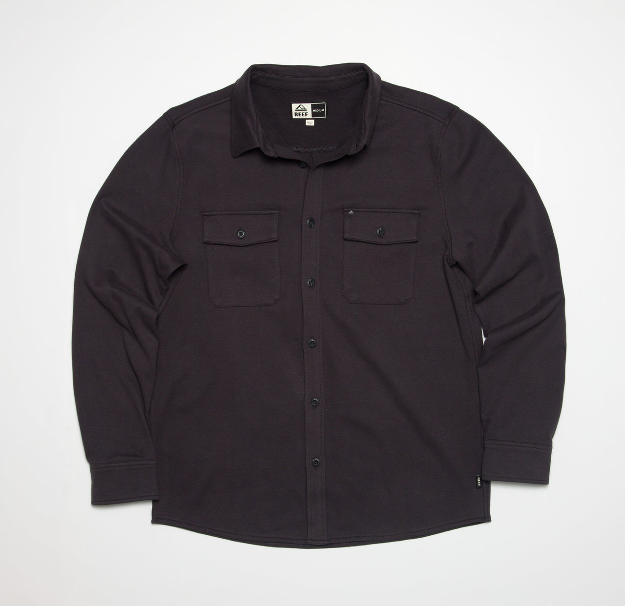 Front view of the Raymond Ls Shirt in dark fabric, featuring button closures and dual chest pockets.