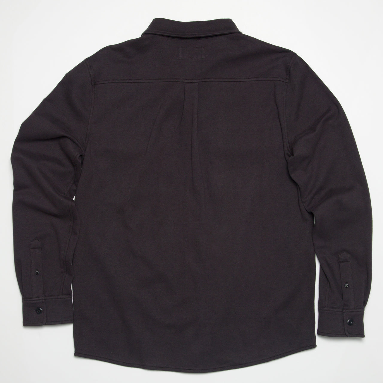 Raymond Ls Shirt showing back view in dark color, surf-inspired comfort apparel designed for beach and active lifestyles.