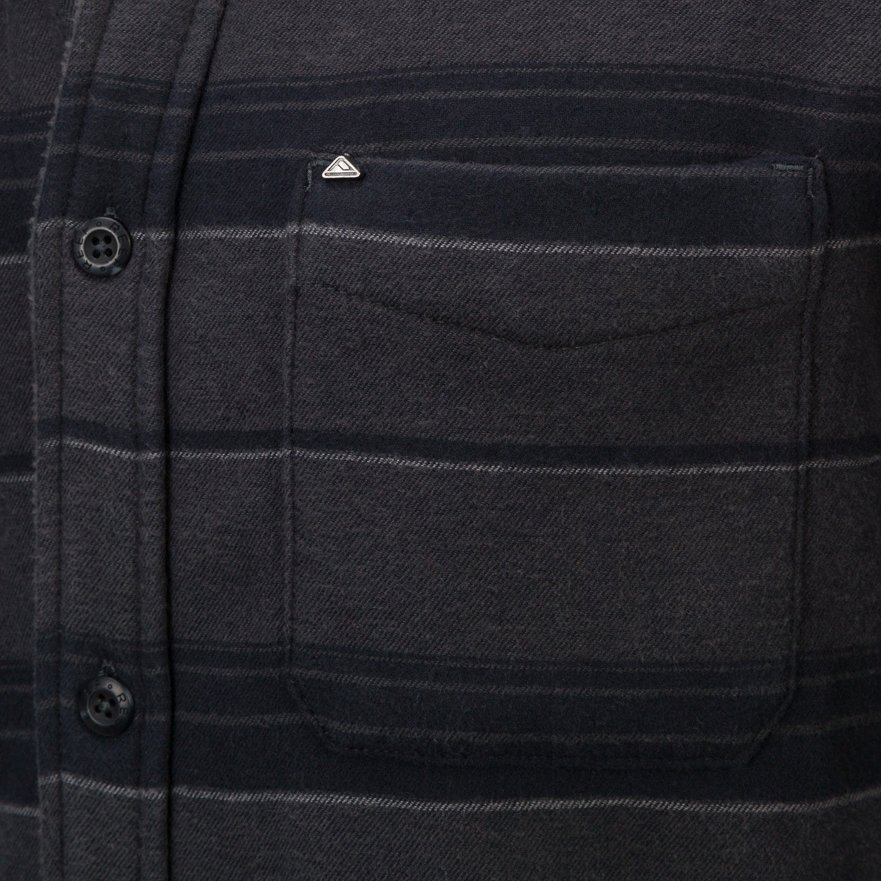 Close-up of the chest pocket on the Bartlett Woven Jacket, featuring soft, durable, beach-inspired apparel fabric.