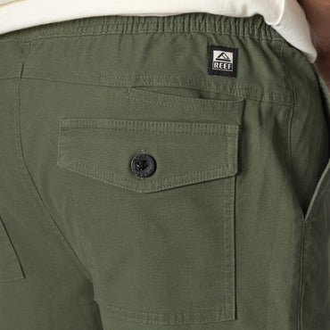 Close-up of the back pocket and waistband on men's Matthew Twill Pant in green, showcasing durable, comfortable apparel.