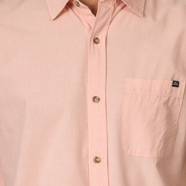 Close-up of a light pink Collins Ss Woven Shirt showing front buttons and chest pocket with surf-inspired design.
