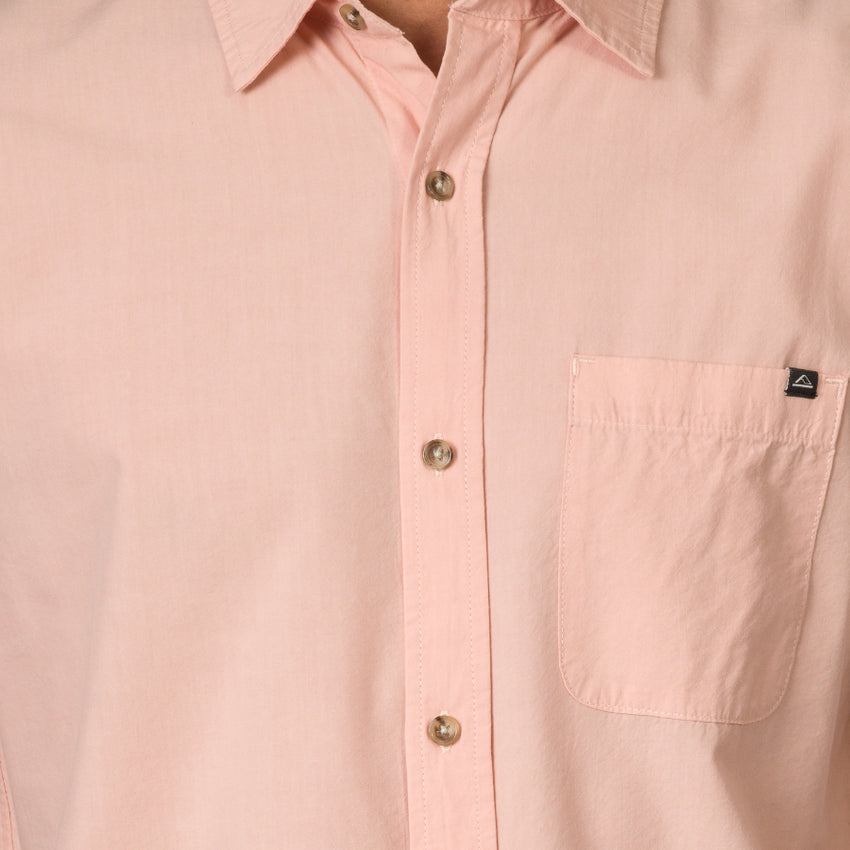 Close-up of a light pink Collins Ss Woven Shirt showing front buttons and chest pocket with surf-inspired design.