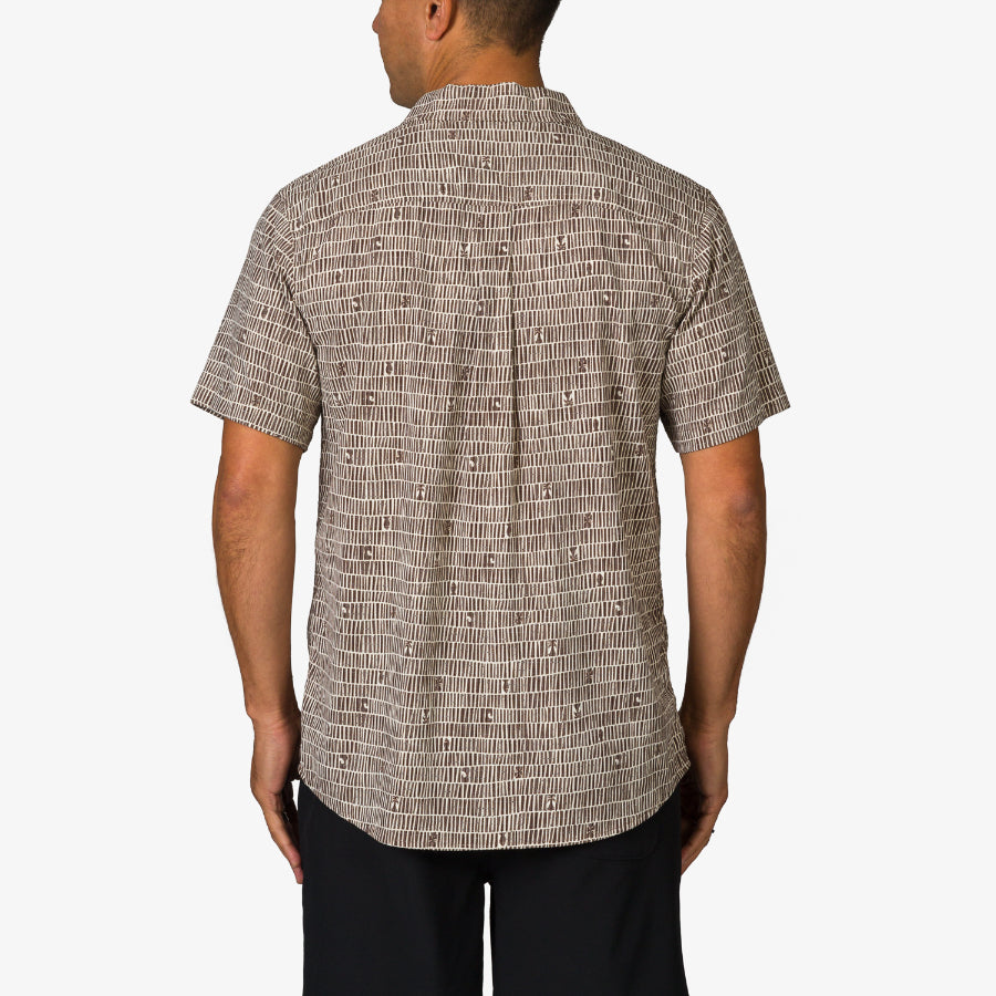 Man wearing a Ferris Classic Shirt in brown pattern, shown from the back, casual beach-inspired men's apparel.