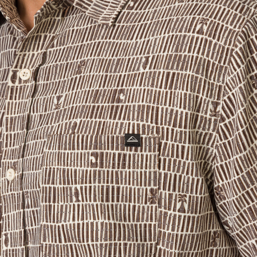 Close-up of chest pocket on Ferris Classic Shirt in brown patterned fabric, designed for men's beach-inspired comfort apparel.