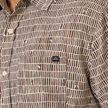 Close-up of chest pocket on Ferris Classic Shirt in brown patterned fabric, designed for men's beach-inspired comfort apparel.