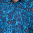 Close-up of the front chest pocket and buttons on the Tyson Classic Shirt in blue tropical print for men’s apparel.