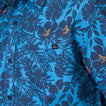 Close-up of the chest pocket on the Tyson Classic Shirt with blue tropical floral print for men’s beachwear.
