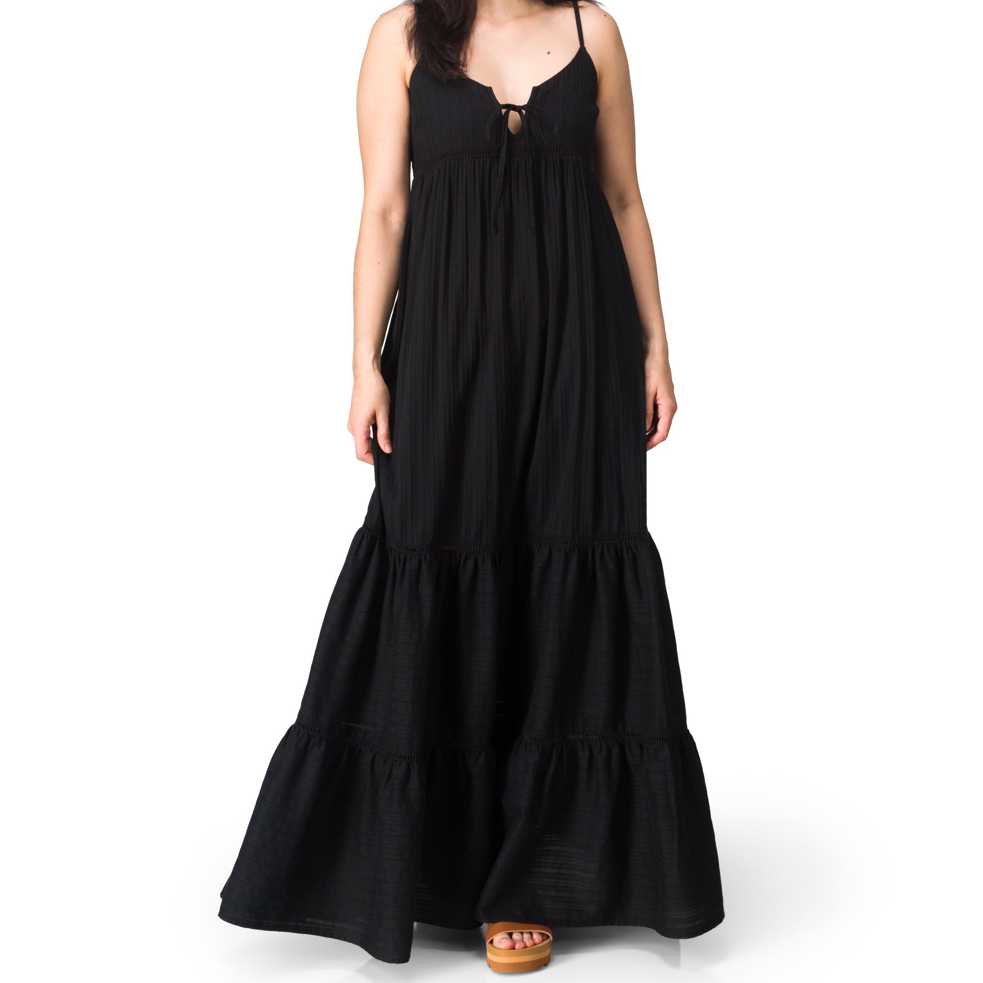 Model wearing a black Yuni Maxi Dress with deep notched neckline and tie detail, full length, front view, StoreRank.ai All Products