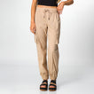 Front view of women's Cargo Jogger Pant in beige, paired with black platform sandals featuring soft-rebound cushioning.