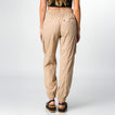 Woman wearing beige Cargo Jogger Pant shown from back, wearing black sandals facing rear, highlighting relaxed fit and pockets