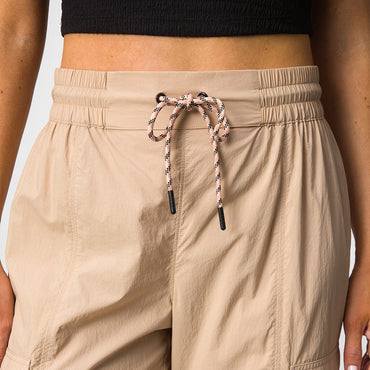 Front close-up of beige Cargo Jogger Pant waist with adjustable drawstring and elastic band designed for women’s comfort.