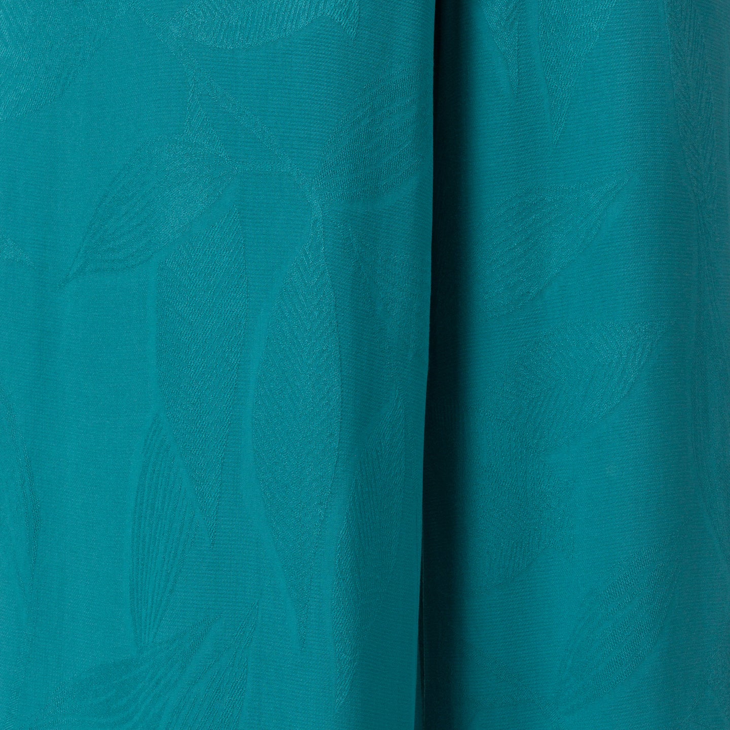 Ollie Tank close-up of teal fabric texture with subtle surf-inspired pattern, designed for comfort and beach lifestyle.