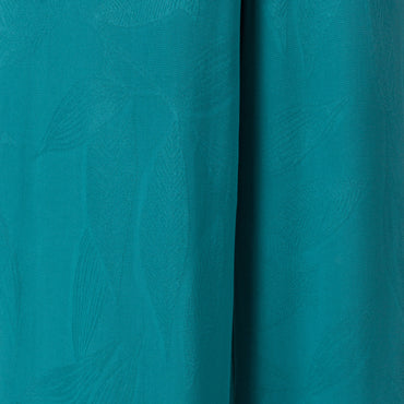 Ollie Tank close-up of teal fabric texture with subtle surf-inspired pattern, designed for comfort and beach lifestyle.