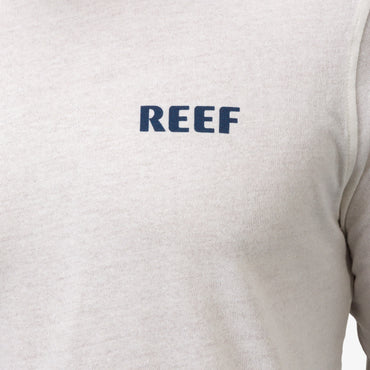 Close-up of the front chest logo on the Wellie 24 Long Sleeve Tee, surf-inspired comfort apparel by REEF.