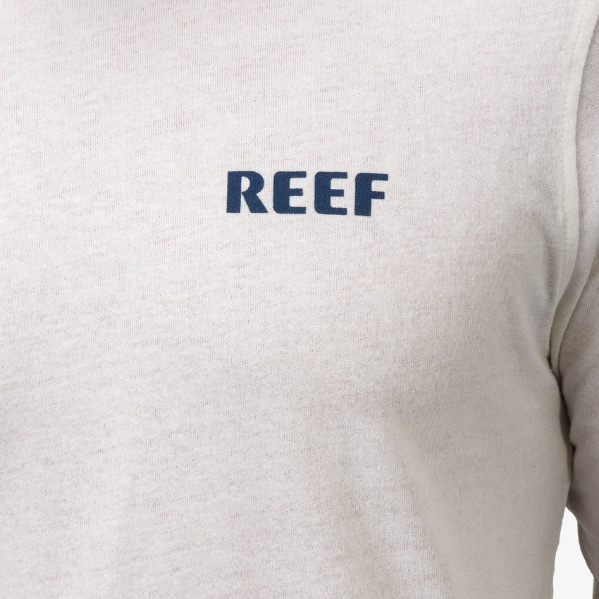 Close-up of the front chest logo on the Wellie 24 Long Sleeve Tee, surf-inspired comfort apparel by REEF.