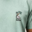 Close-up of the chest on a men's Akin Tee in muted green with Skull and palm tree surf-inspired graphic design