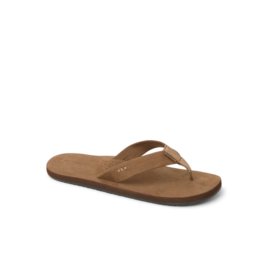 Reef Draftsmen men's brown sandal facing left, close-up on cushioned footbed with arch support for beach comfort