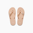 Kids Charming beige flip flops for girls, top view showing toe straps with reef logo, beach inspired comfort sandals.