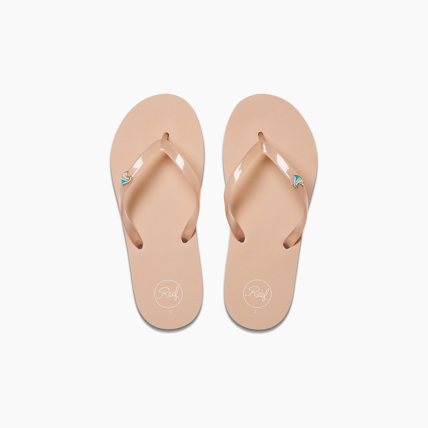 Kids Charming beige flip flops for girls, top view showing toe straps with reef logo, beach inspired comfort sandals.