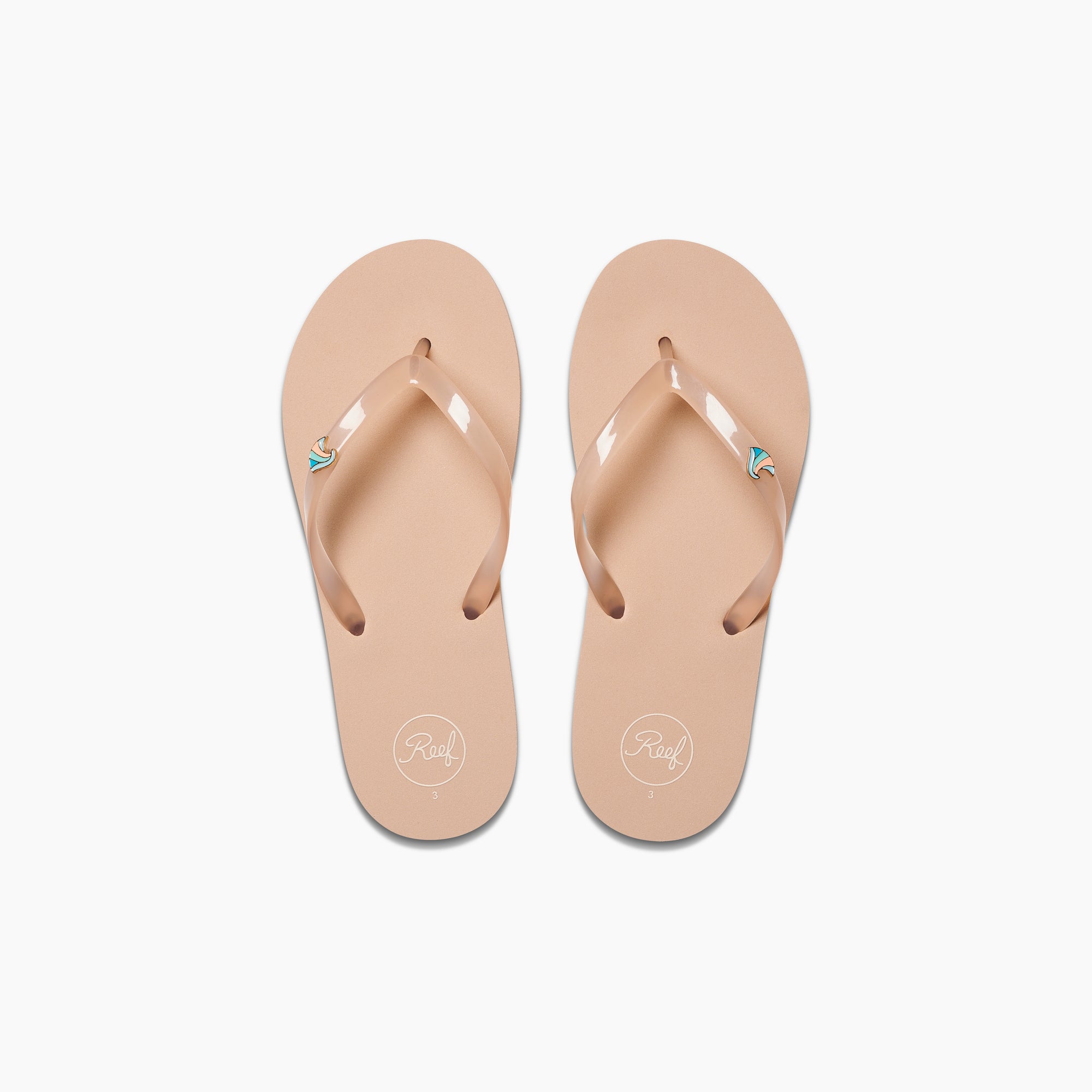 Kids Charming beige flip flops for girls, top view showing toe straps with reef logo, beach inspired comfort sandals.