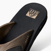 Fanning men's right sandal facing up showing textured footbed with anatomical arch support and cushioned strap