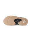 Fanning men's flip flop outsole facing up, brown herringbone tread with black bottle opener and REEF logo for beach comfort