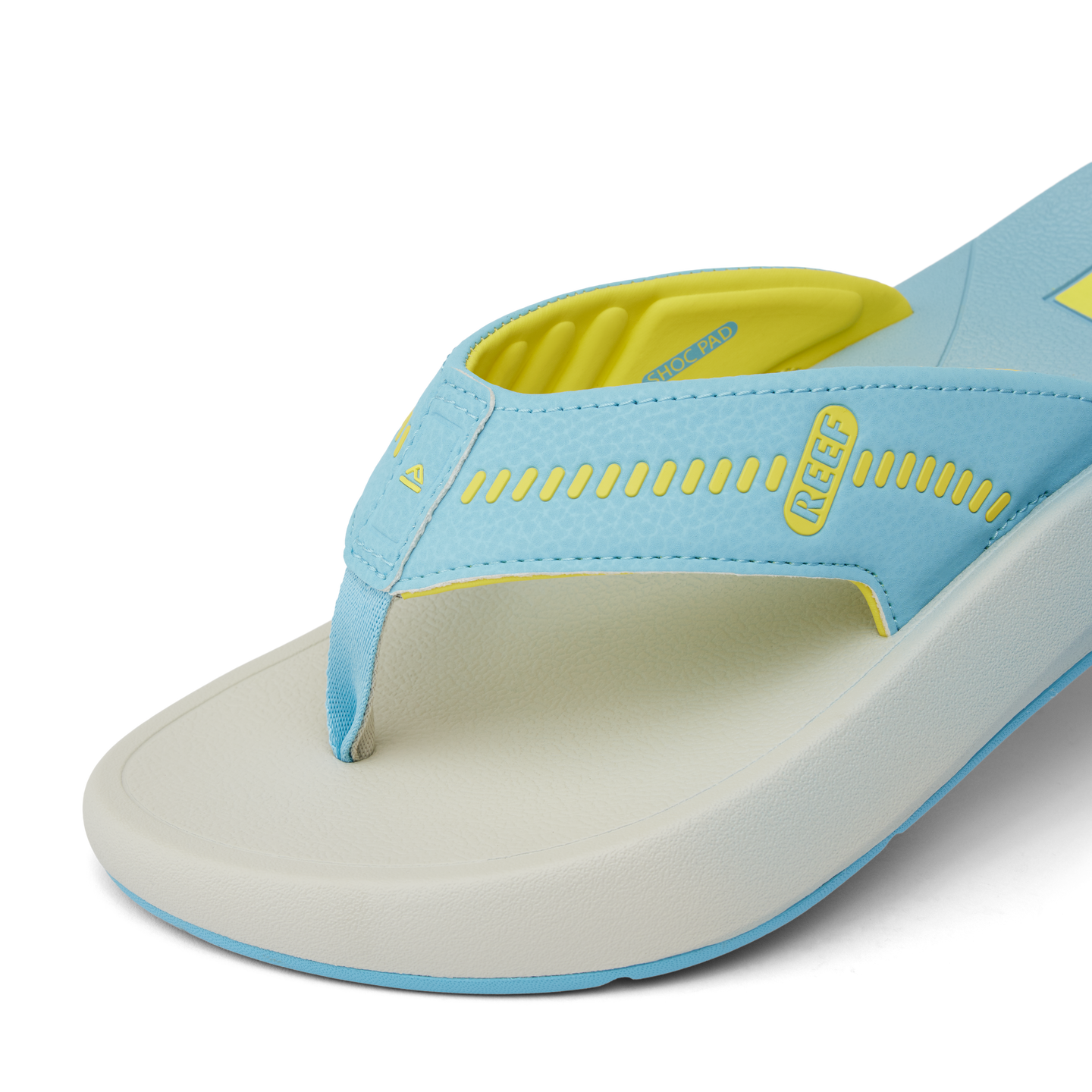 Close-up of the front right side of the Cruiser sandal in light blue and yellow showing soft-rebound cushioning and anatomical arch support.