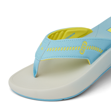 Close-up of the front right side of the Cruiser sandal in light blue and yellow showing soft-rebound cushioning and anatomical arch support.