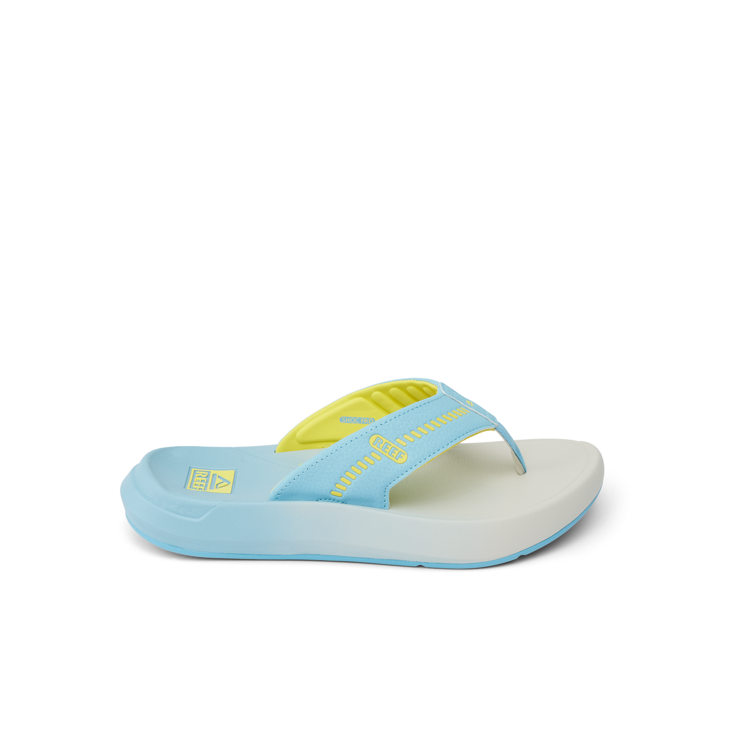 Cruiser sandal facing right, close-up of light blue and yellow slip-on with cushioned arch support and water-friendly sole.