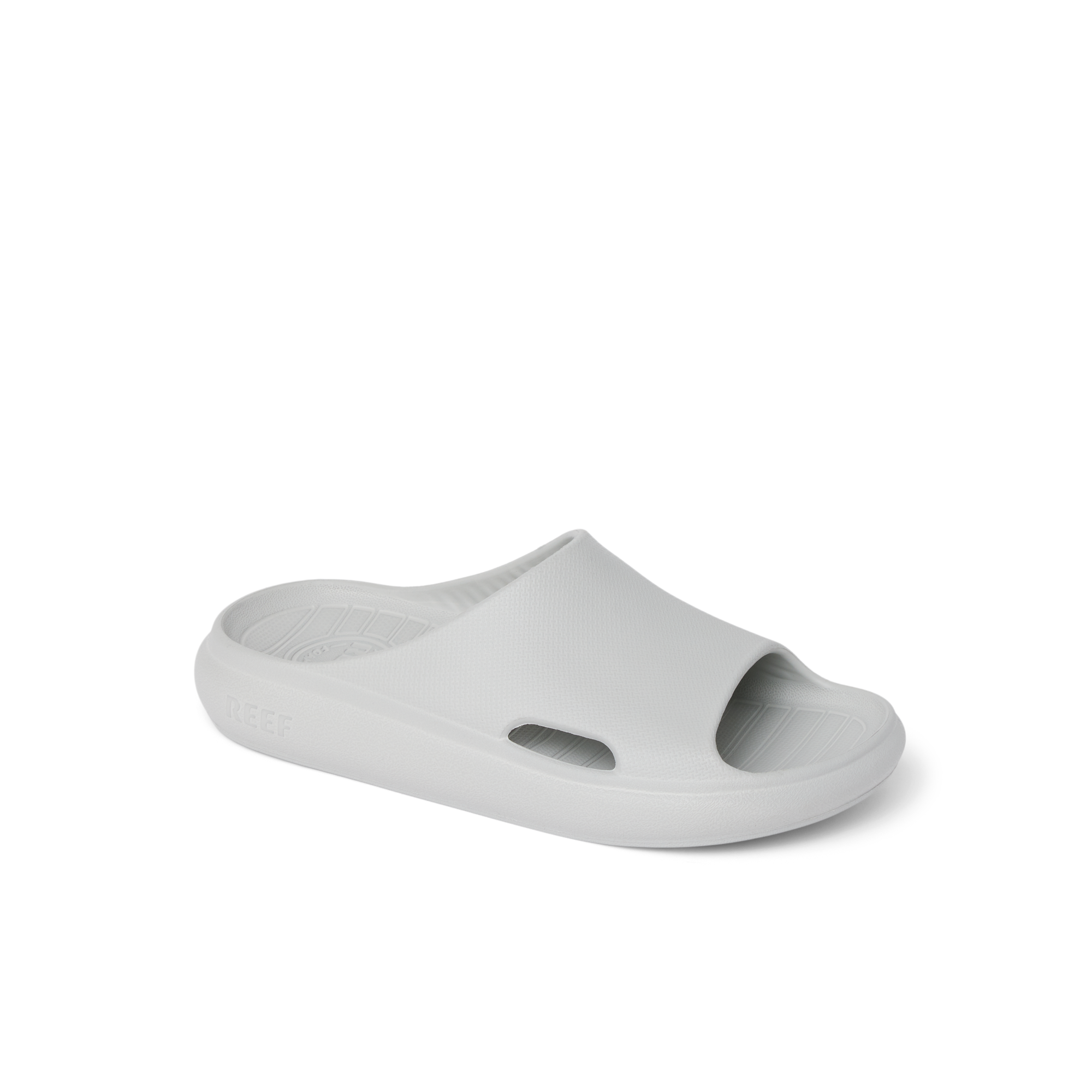 Kids Rio Slide in light grey facing right, close-up of front and side, breathable, water-friendly, cushioned slides for kids.