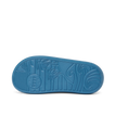 Kids Rio Slide showing the bottom sole facing up with surf-inspired wave and palm tree tread pattern in navy blue rubber