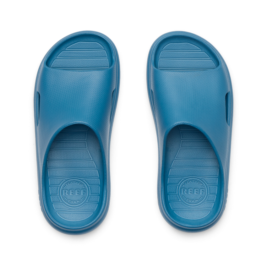 Top-down view of blue Kids Rio Slide facing upward, showing soft-rebound cushioning and anatomical arch support.