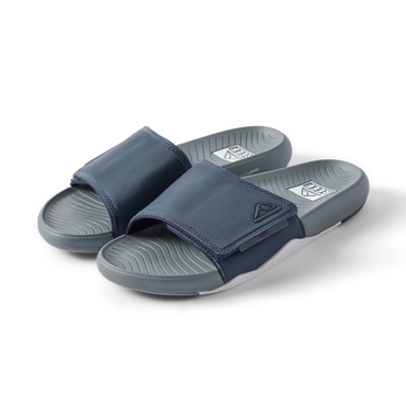 Pair of navy Phantom Slab slides facing right, showing cushioned footbeds with anatomical arch support.