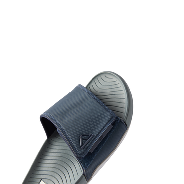 Close-up of the front and top of the right Phantom Slab slide in navy and grey, showing cushioned footbed and adjustable strap.