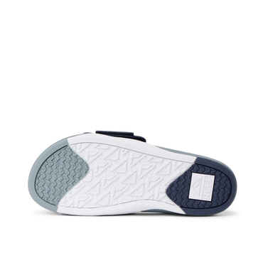 Phantom Slab men's slide showing the sole facing up, highlighting durable, water-friendly outsole for beach comfort.