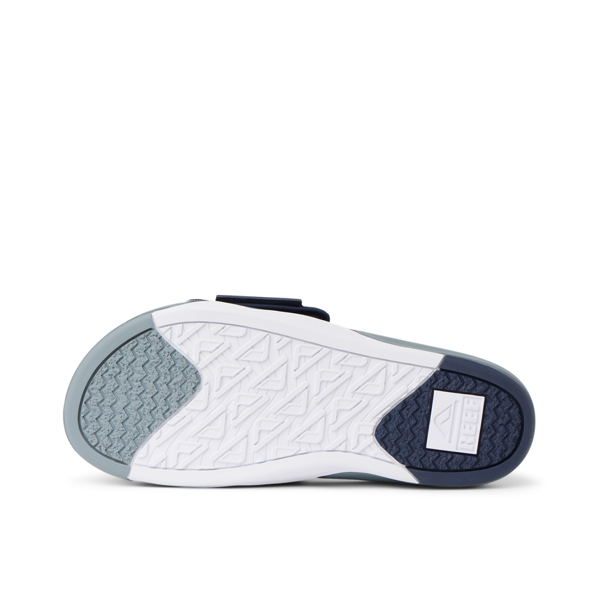 Phantom Slab men's slide showing the sole facing up, highlighting durable, water-friendly outsole for beach comfort.