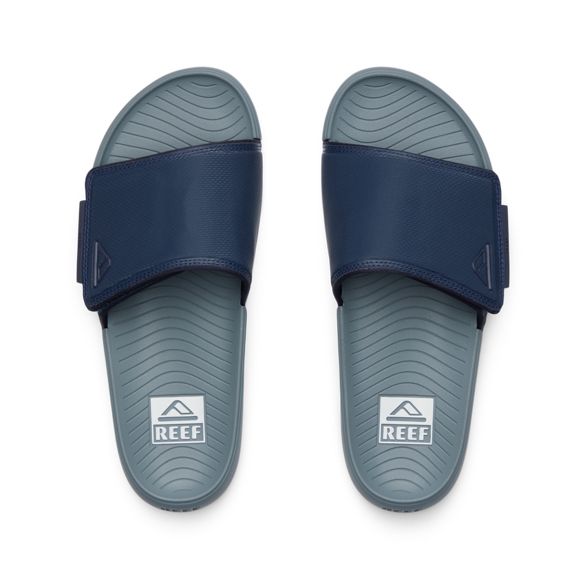 Top-down view of Phantom Slab men's slides in navy and grey, featuring comfort cushioning and anatomical arch support.