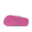 Little Ahi girls’ sandal showing bottom sole facing up with pink textured REEF logo pattern, beach comfort design.