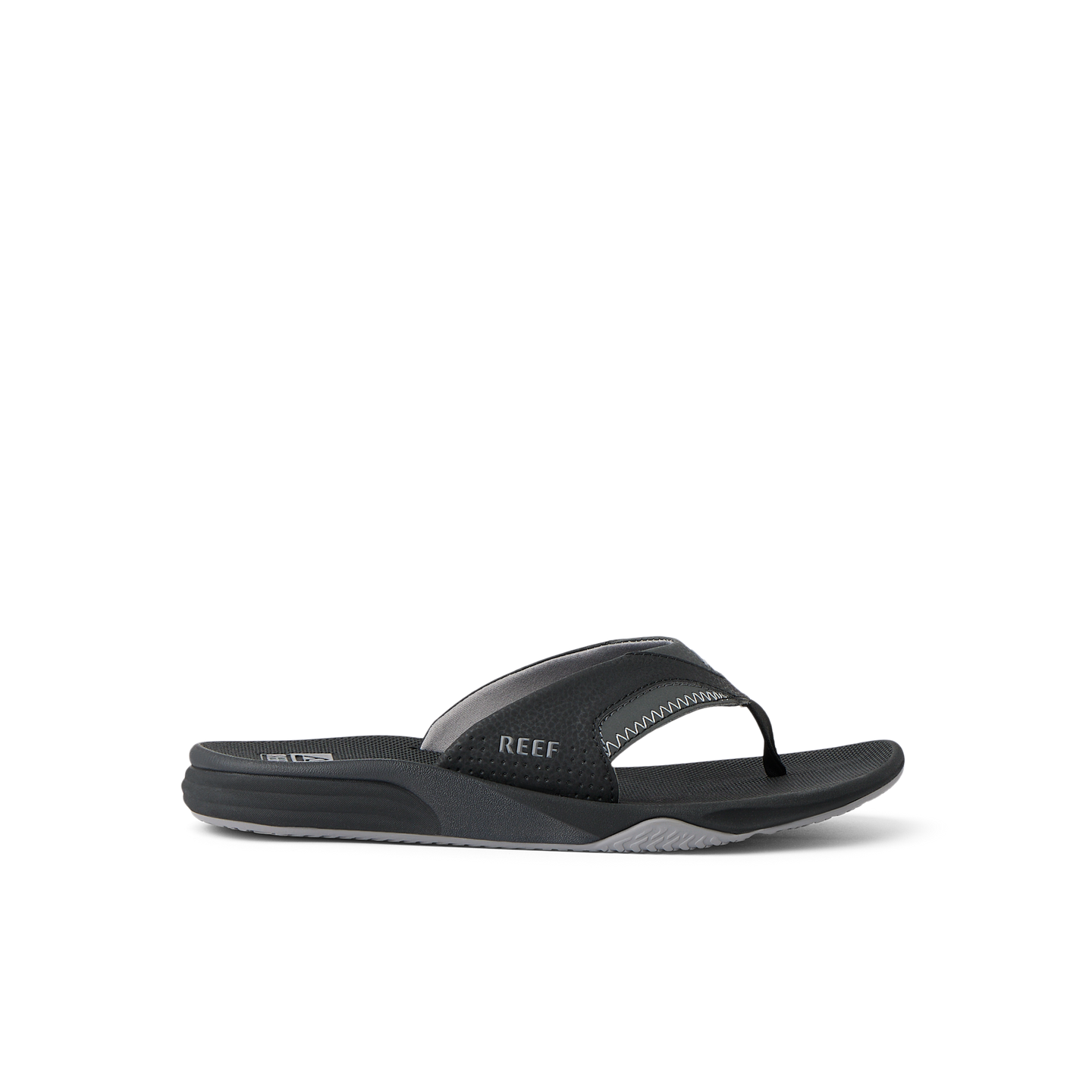 Cushion Fanning black flip flop sandal facing right with arch support and soft cushioning, designed for beach comfort.