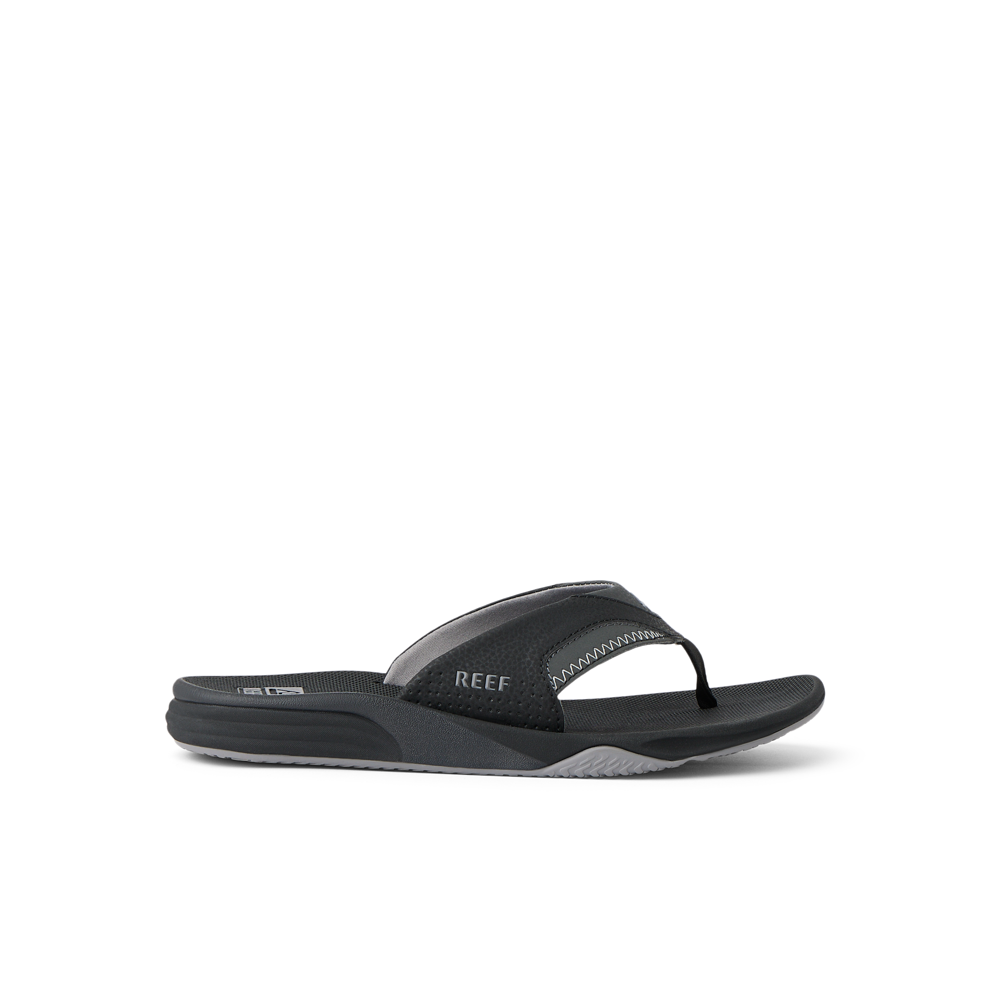 Cushion Fanning black flip flop sandal facing right with arch support and soft cushioning, designed for beach comfort.