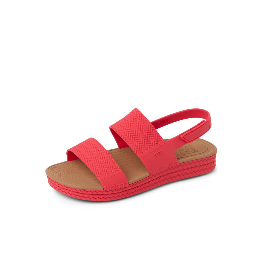 Reef Water Vista women's coral sandal facing left, showing side and top with cushioned footbed and arch support.