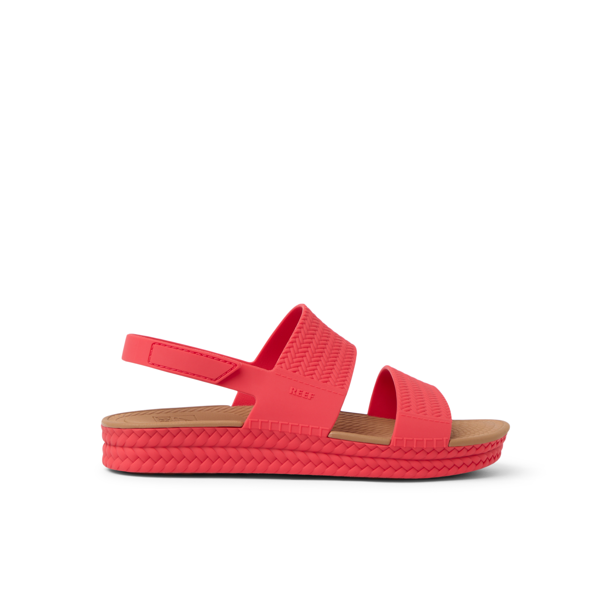 Side view of women's Reef Water Vista sandal in hibiscus red with anatomical arch support and cushioned footbed for beach comfort