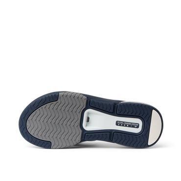 Fanning + men's shoe showing sole with durable, water-friendly materials and anatomical arch support, facing upward.