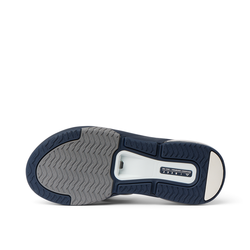 Fanning + men's shoe showing sole with durable, water-friendly materials and anatomical arch support, facing upward.