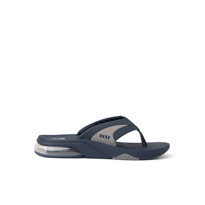 Fanning + men's navy and grey flip flop facing right with soft-rebound cushioning and anatomical arch support