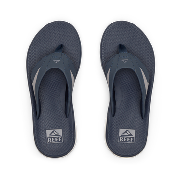 Pair of men's Fanning + flip flops facing upward, navy and grey, with anatomical arch support and cushioned footbeds