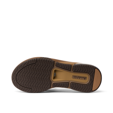 Fanning + men's shoe outsole facing upward, showcasing durable, water-friendly tread and arch support design.